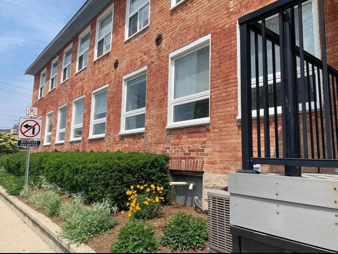 Exterior of the therapy office building with a red brick entrance